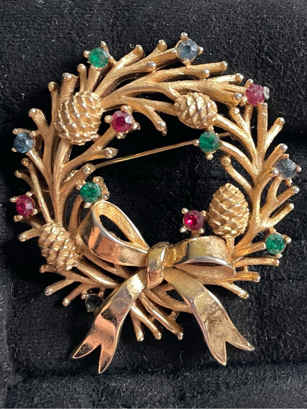 Trifari Gold Toned Holiday Wreath Brooch with Green and Red Stones